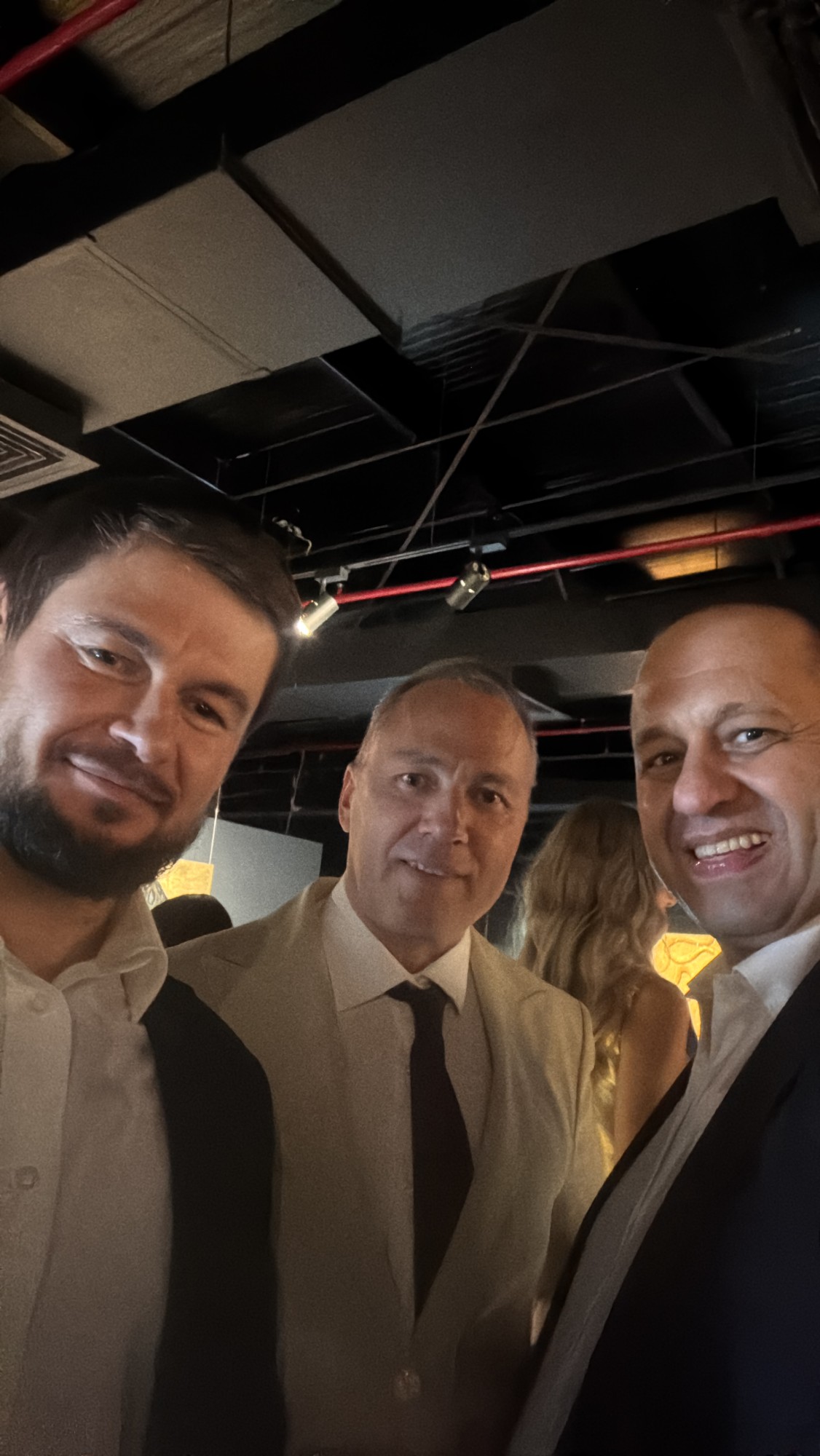 Roman Chertkov with two guests at the gala