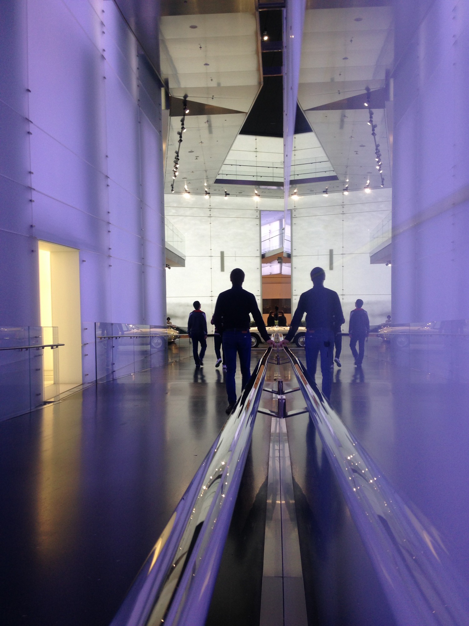 Museum hall in purple light with classic cars