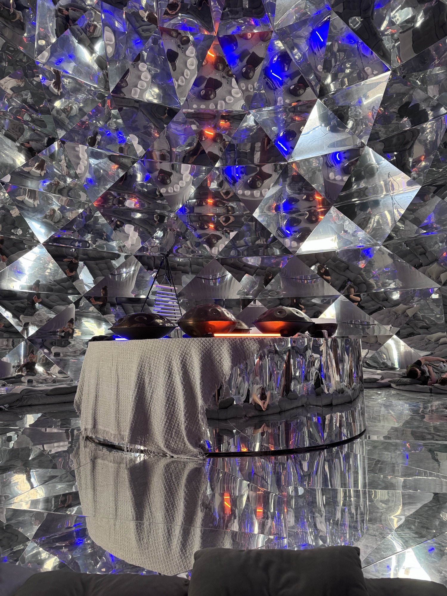 Mirrored kaleidoscope room with a spa bed in the centre