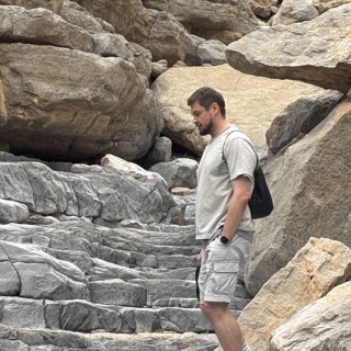 Roman Chertkov in a canyon in Wadi Shehah